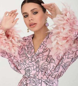 Designer pink dress contemplated nice woman with raised hands